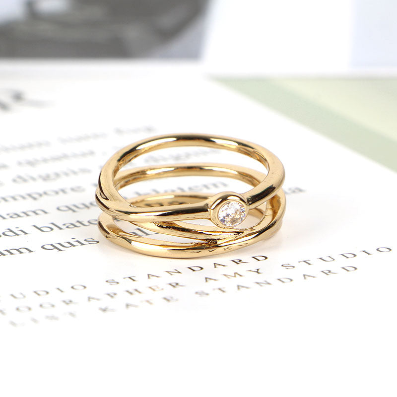 Gold Intertwined Ring with Sparkling Diamond Accent